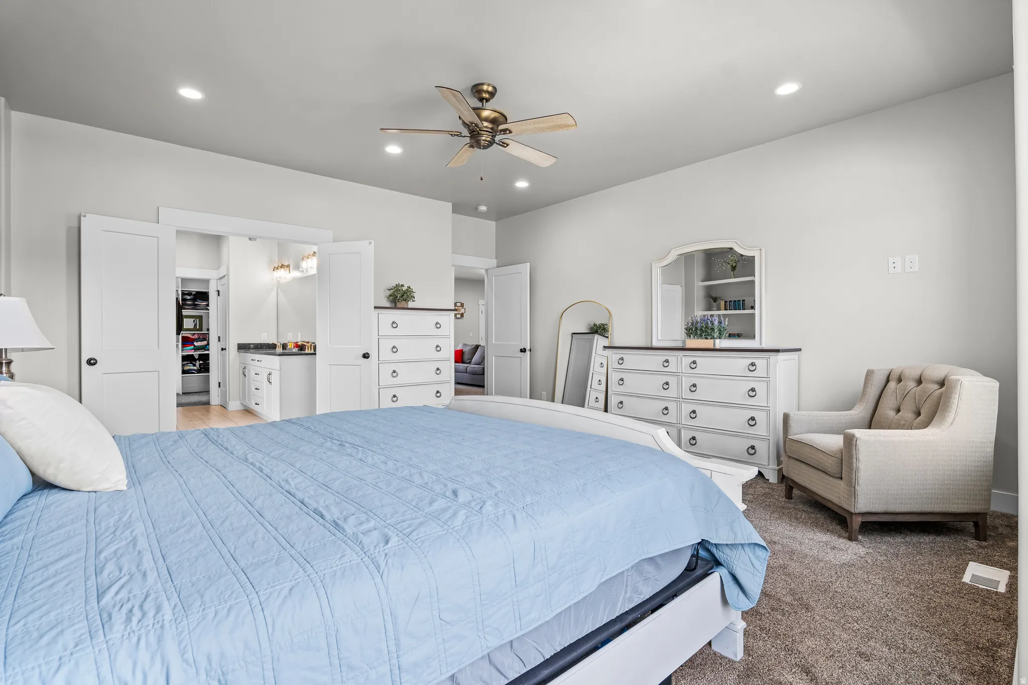 Carpeted room featuring recessed lighting, a ceiling fan, and white walls