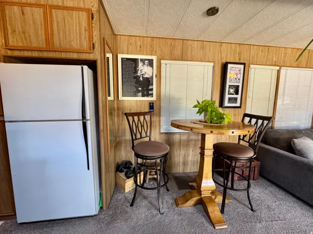 Wood-finish wall paneling throughout the space