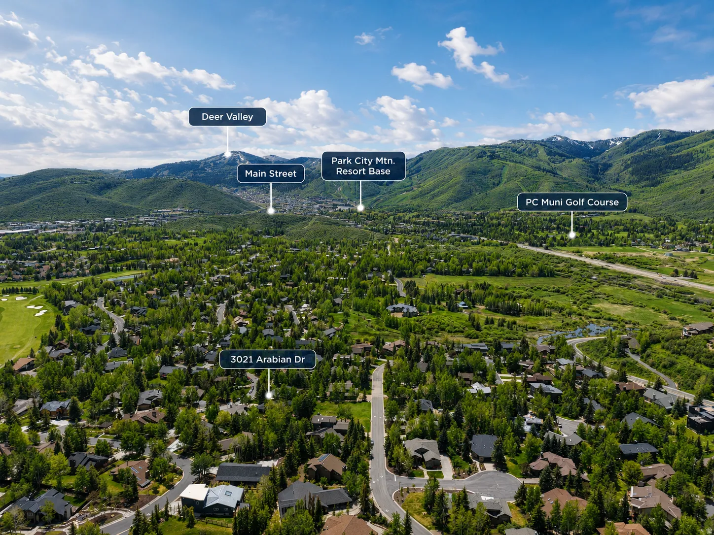 Aerial overview showcasing the property's setting within a mountainous landscape