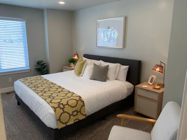 Bedroom featuring a recessed light, window with blinds, and carpeted flooring