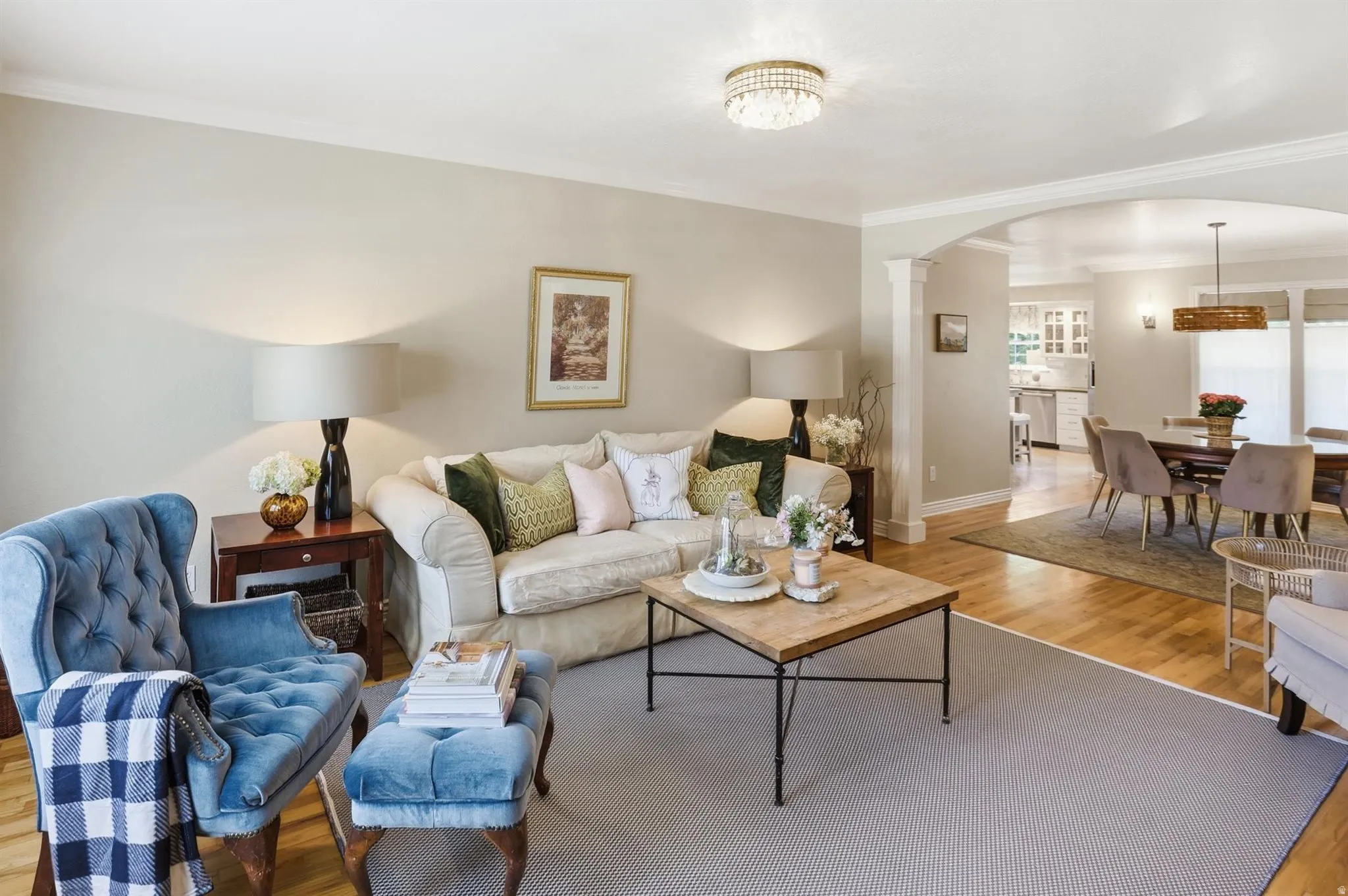 Living room with light-toned walls and wood-finish flooring