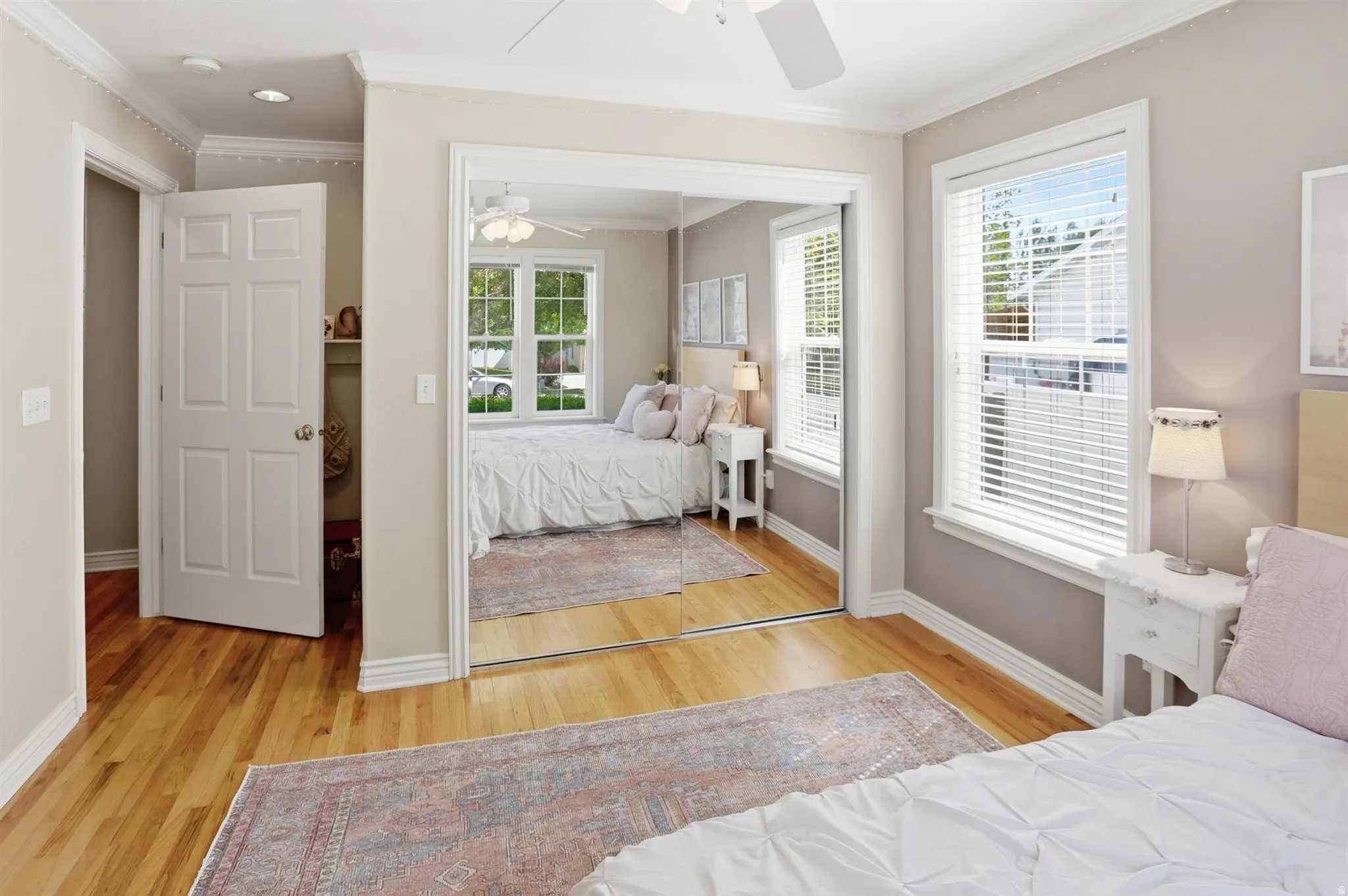 Hardwood flooring paired with crown molding and baseboards