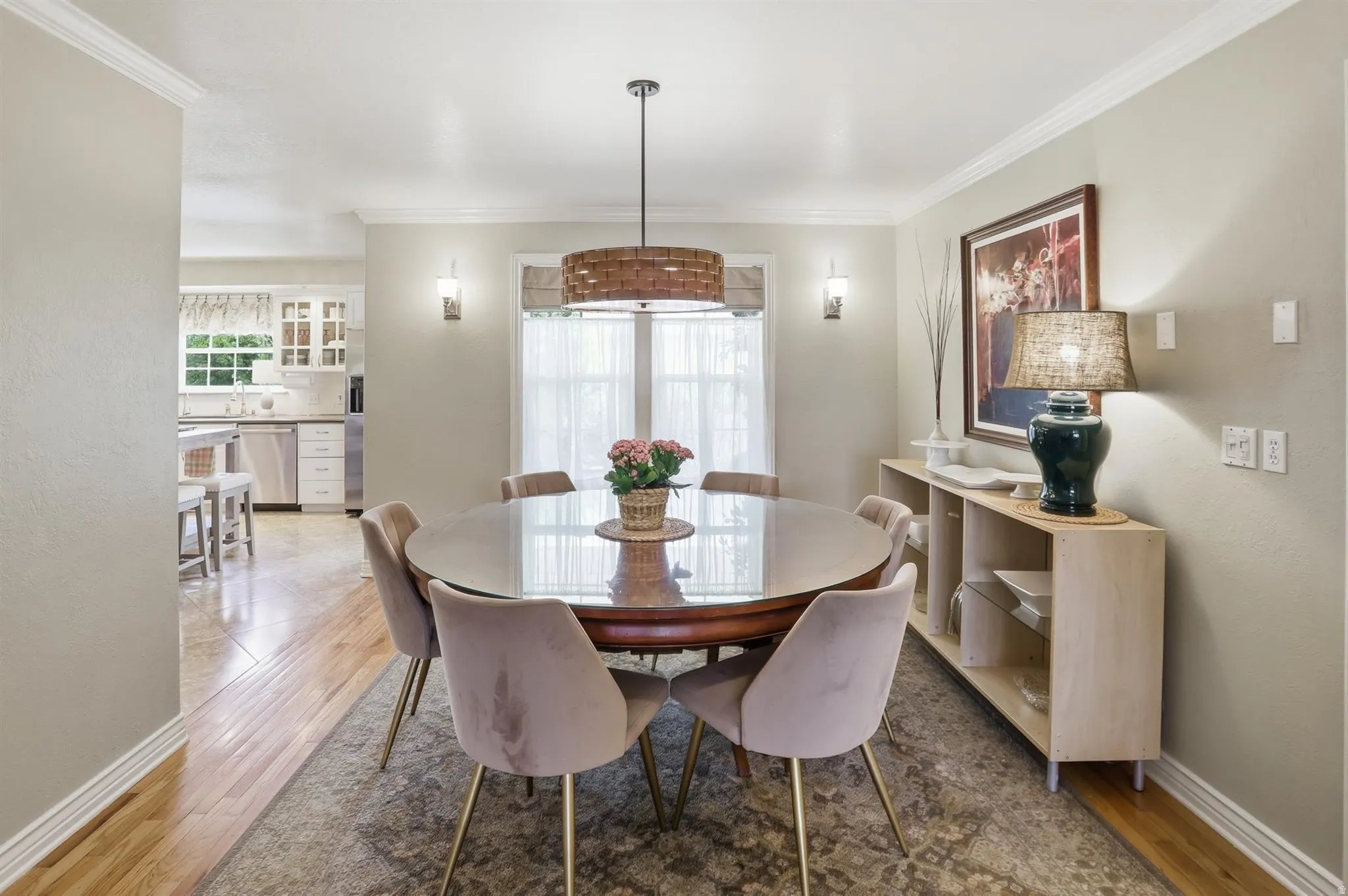 Formal dining area featuring crown molding and wood-finish flooring