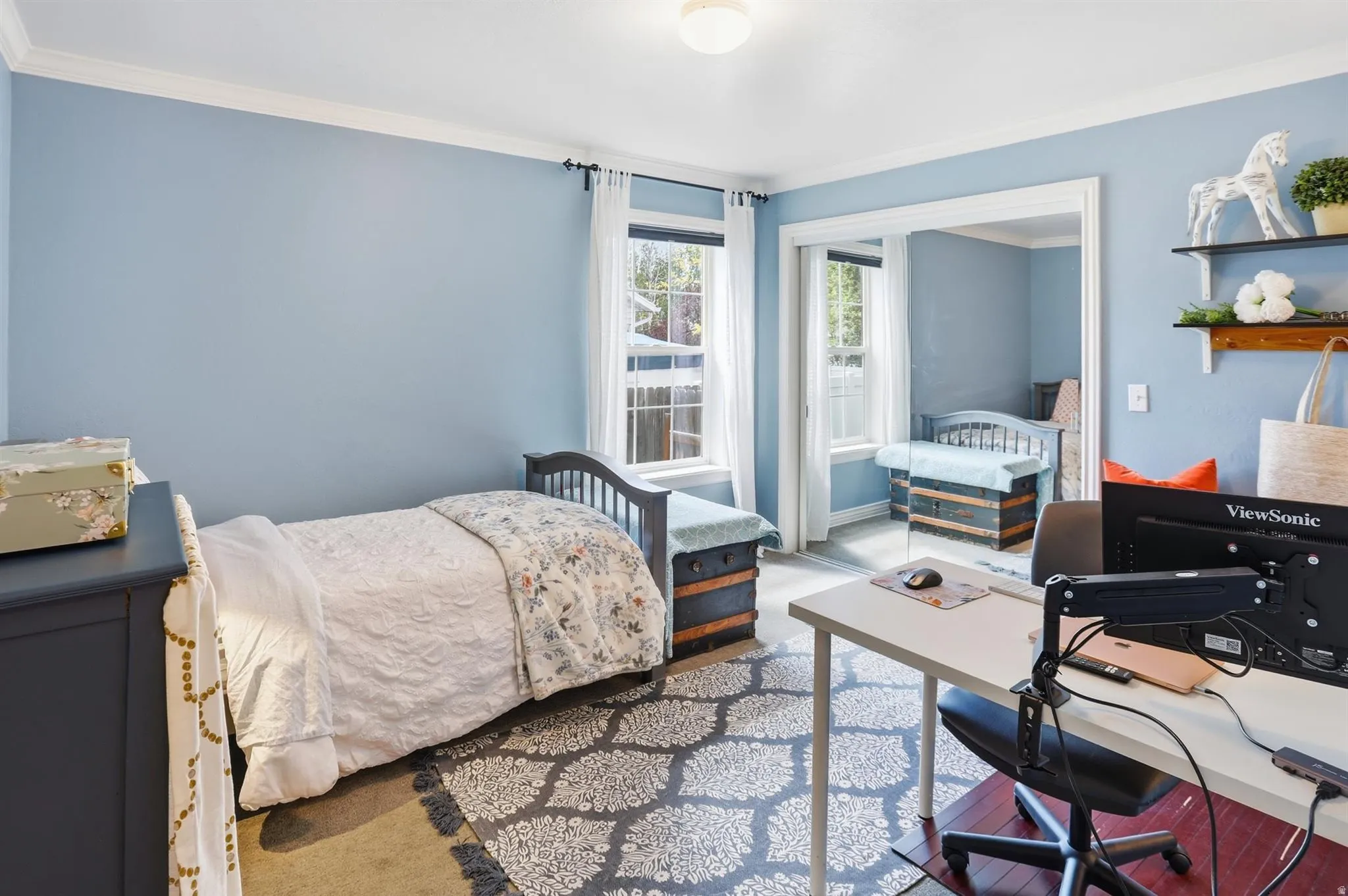 Bedroom 2 Light blue walls with white crown molding