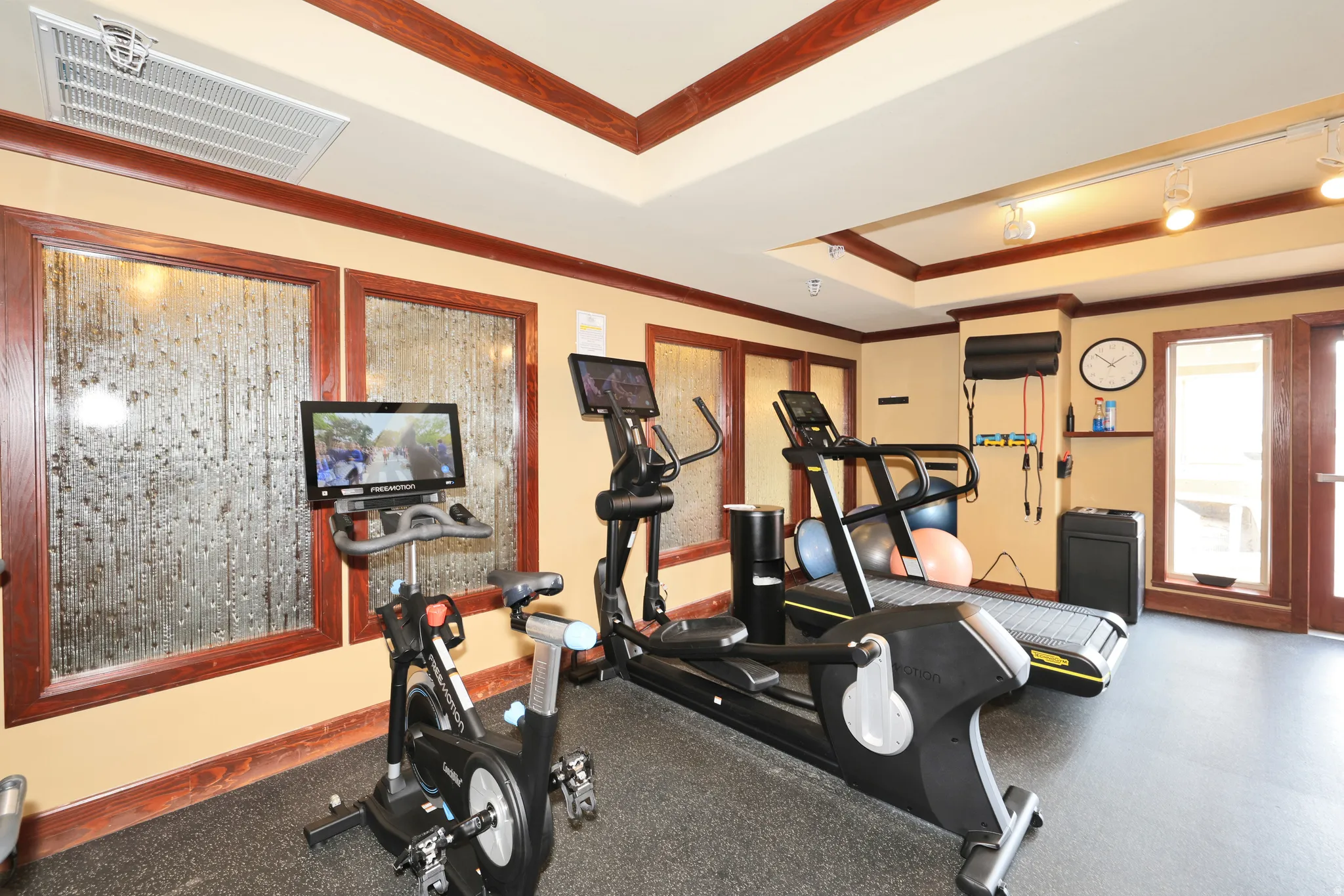 Dedicated fitness space featuring rubberized flooring