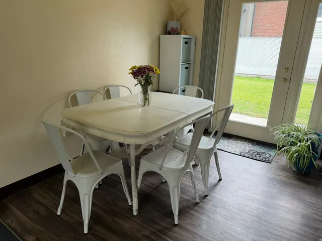Dining area with dark wood-finish flooring