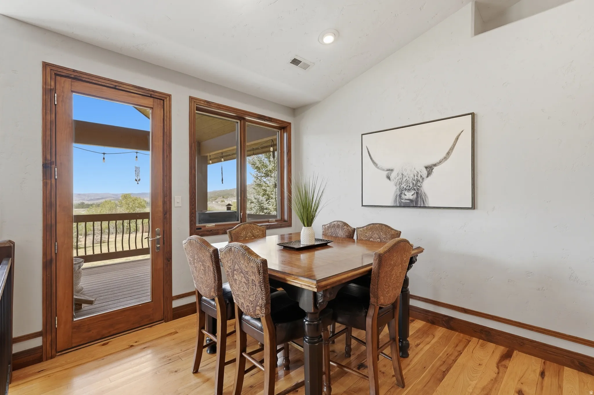 Light wood-finish flooring with wood trim