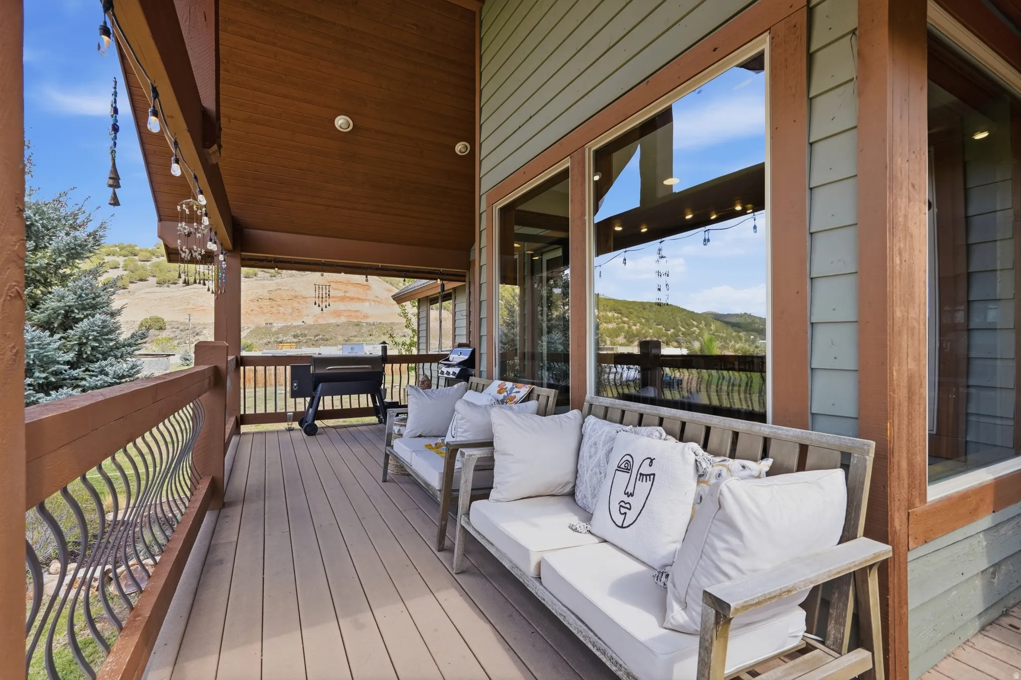 Expansive outdoor deck featuring wood-finish flooring and a wood-paneled ceiling