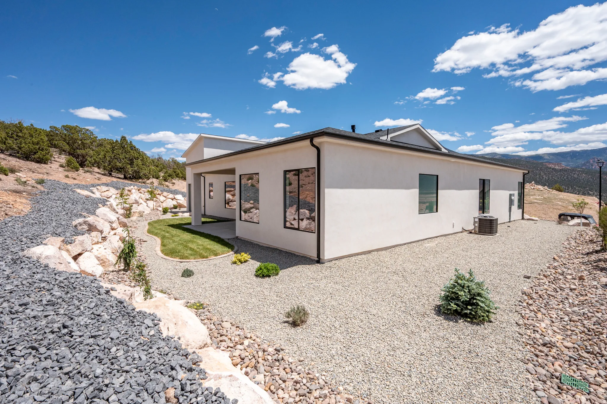 Modern stucco exterior with black-framed windows
