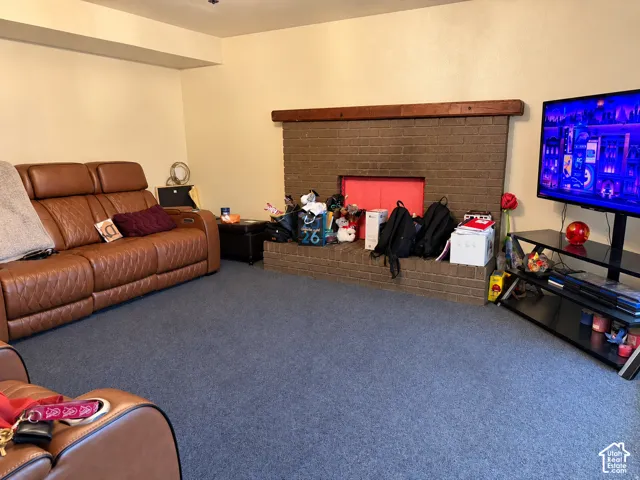 Brick fireplace with a wood mantel