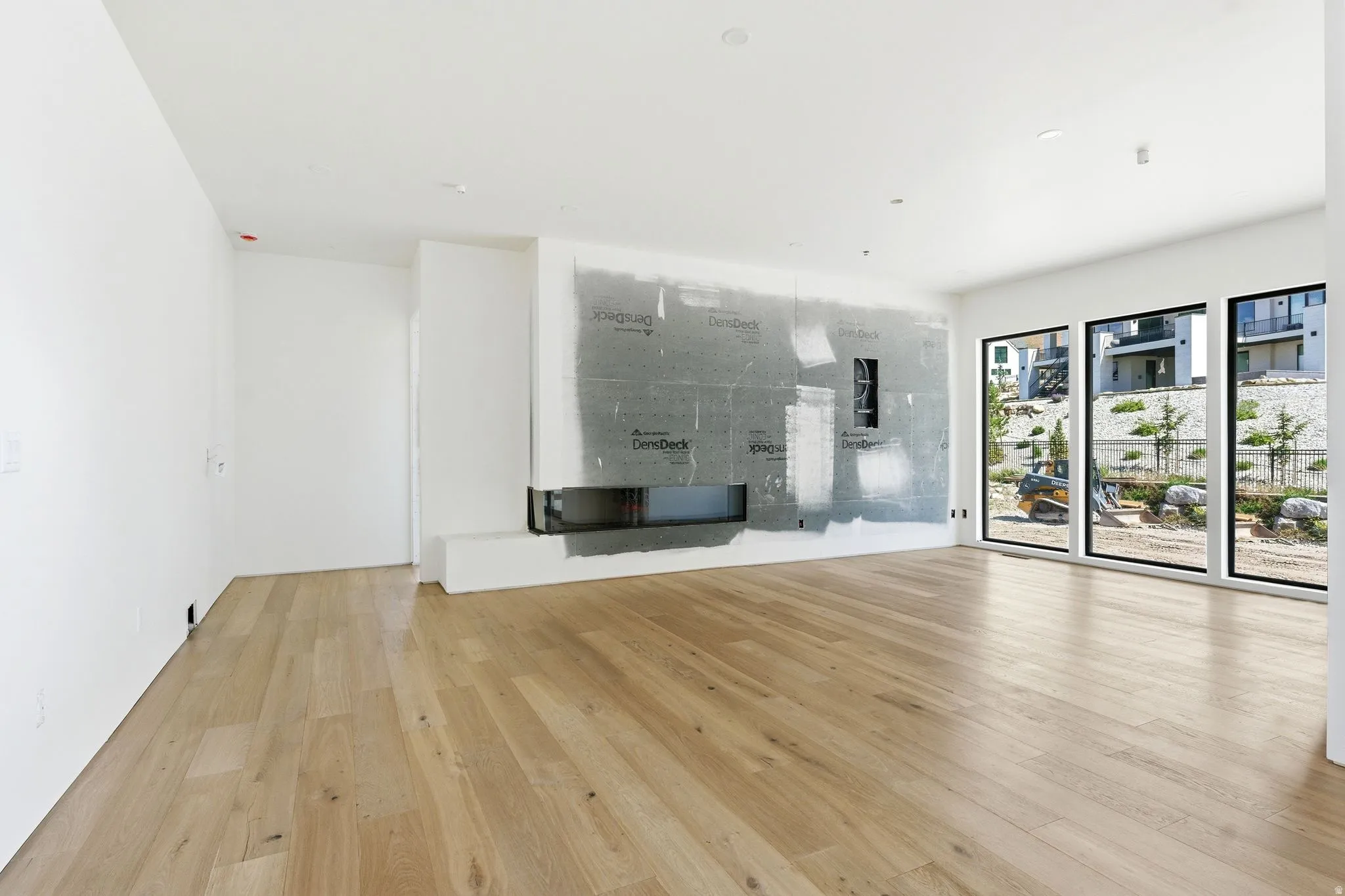 Spacious interior with natural wood-finish flooring