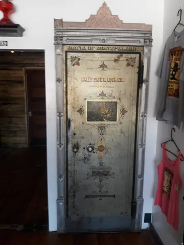 Ornate vintage safe door with decorative trim and detailed embellishments
