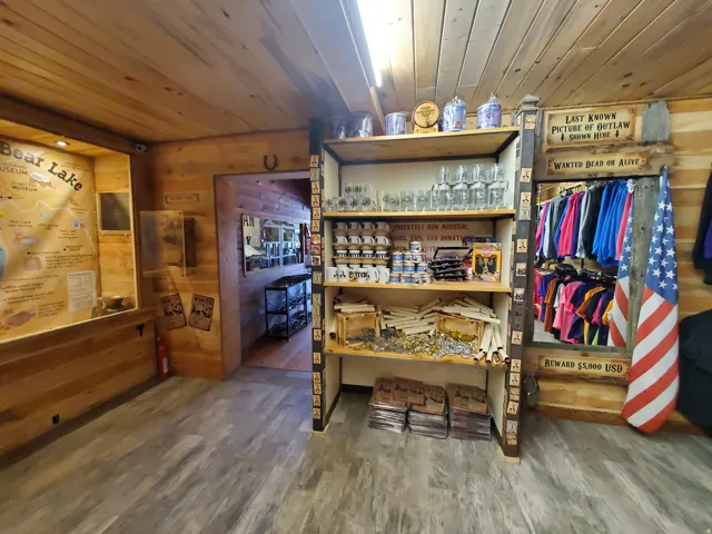Retail interior featuring wood-finish flooring, wood panel walls, and a wood panel ceiling