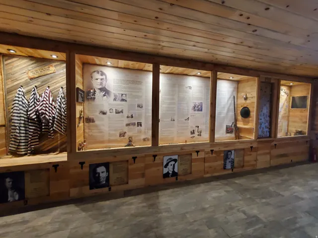 Wood-paneled interior featuring recessed lighting and integrated display cases