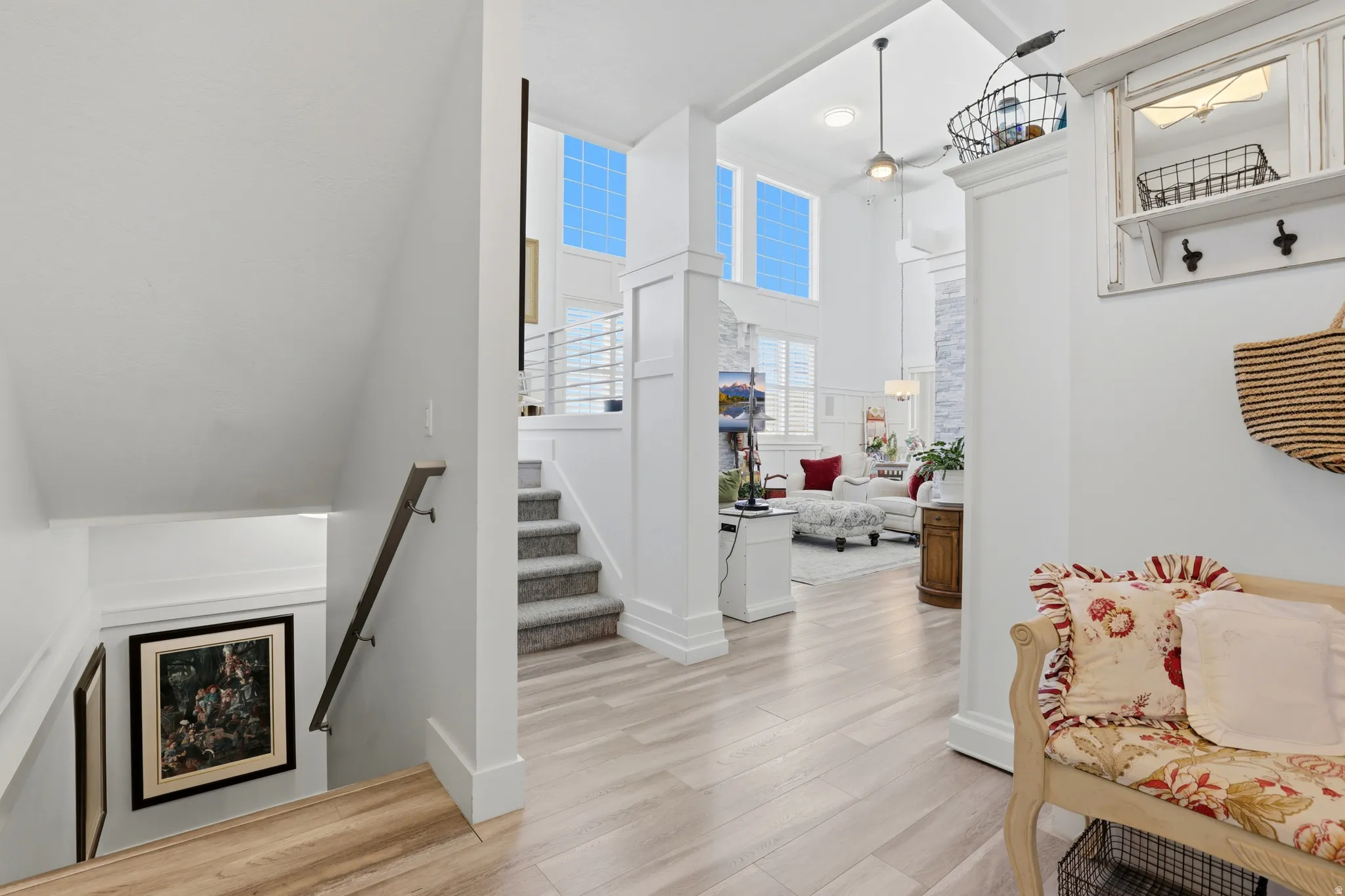 Light wood-finish flooring extending into the open-concept living area