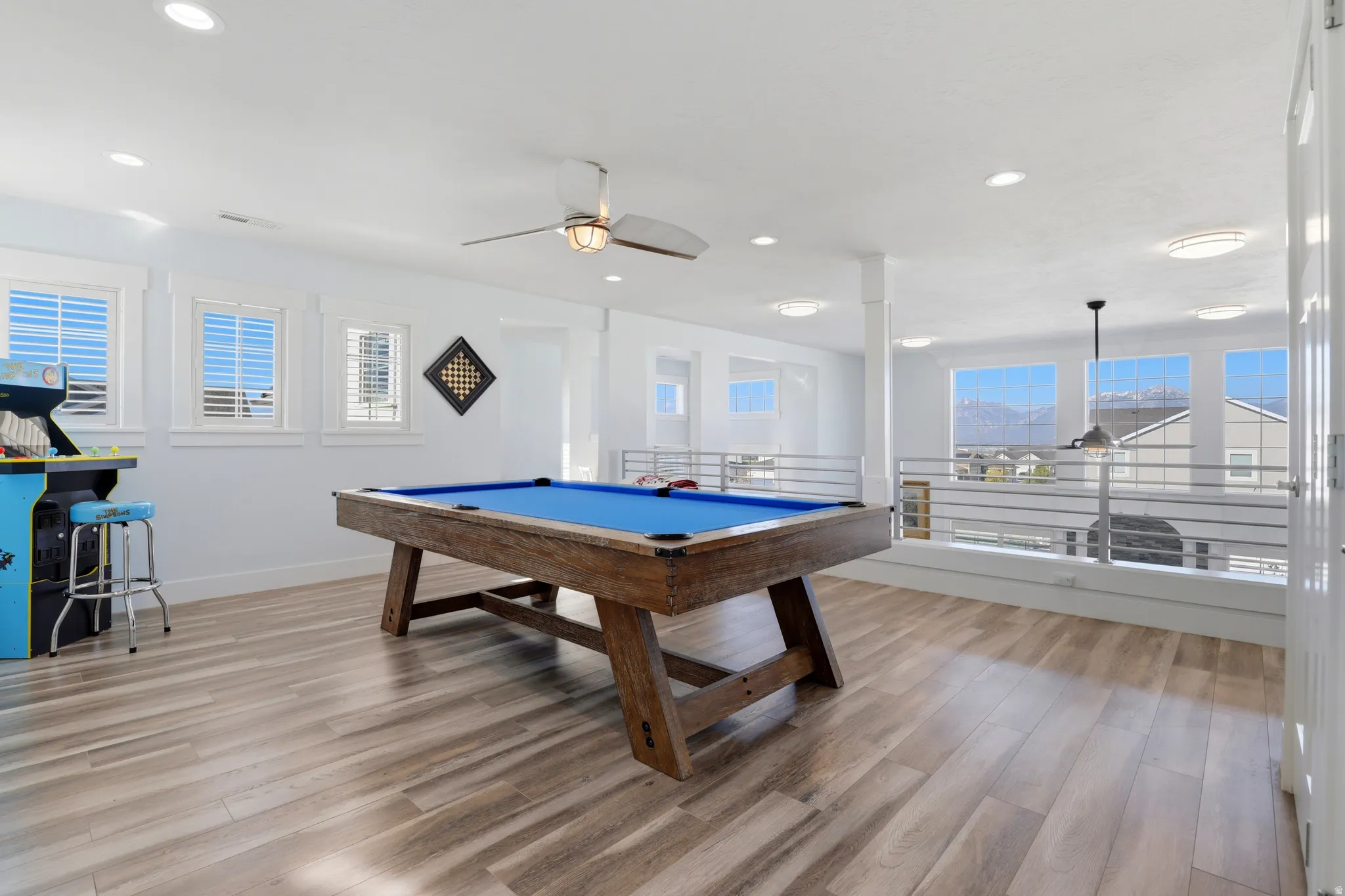 Spacious bonus room featuring wood-finish flooring, recessed lighting, and a ceiling fan