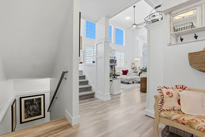Light wood-finish flooring extending into the open-concept living area