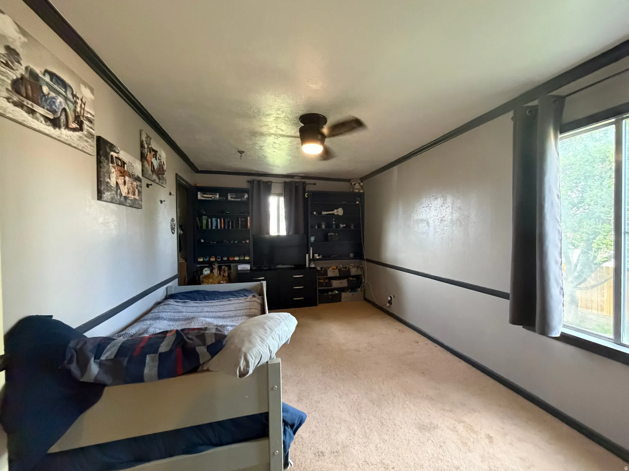 Interior room featuring light-toned walls with dark trim