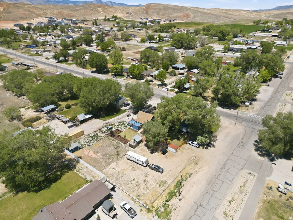 Aerial view of a residential area with established trees and visible streets