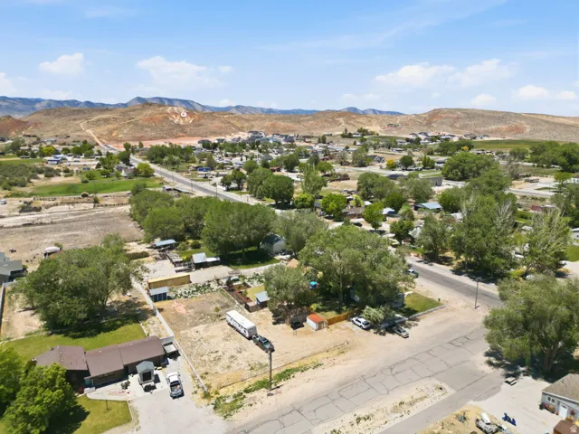 Aerial perspective showcasing an expansive property within a broader community setting