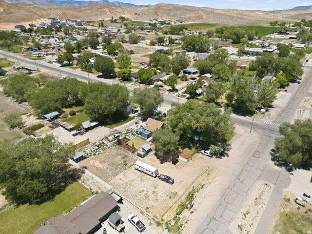 Aerial view of a residential area with established trees and visible streets