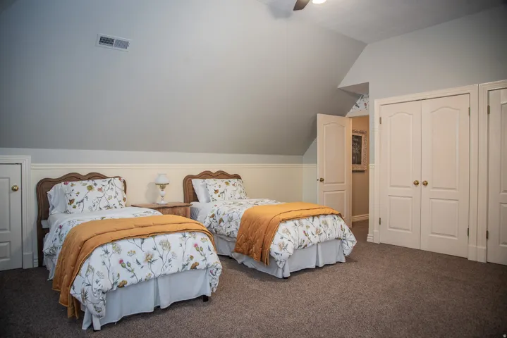 Extra large bedroom with window seats, under-eaves storage closets, and two additional closets