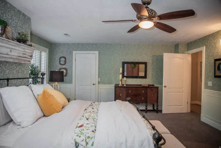 Spacious primary bedroom showing one of THREE closets!