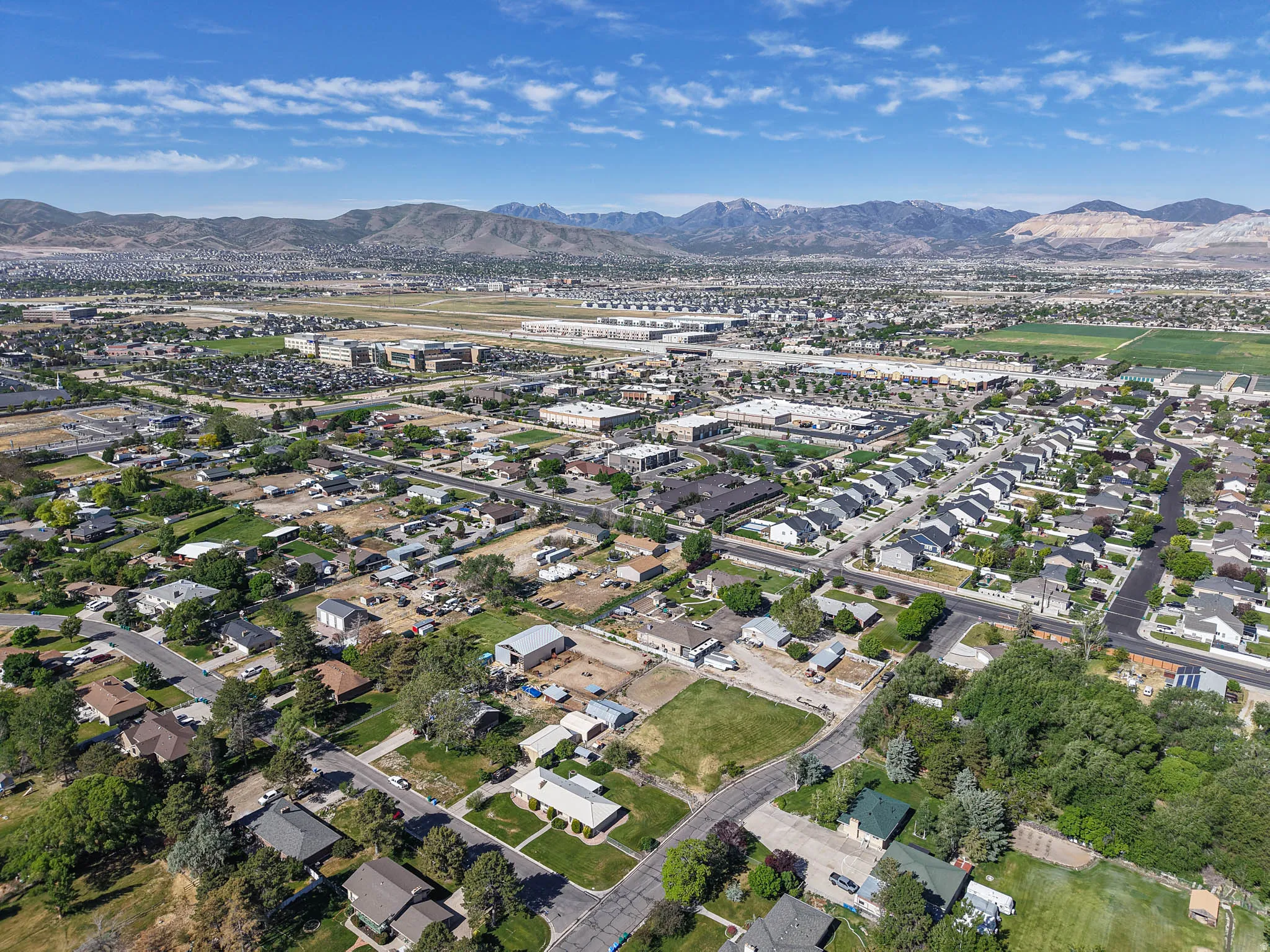 Aerial perspective showcasing a residential landscape with varied housing styles and substantial green spaces