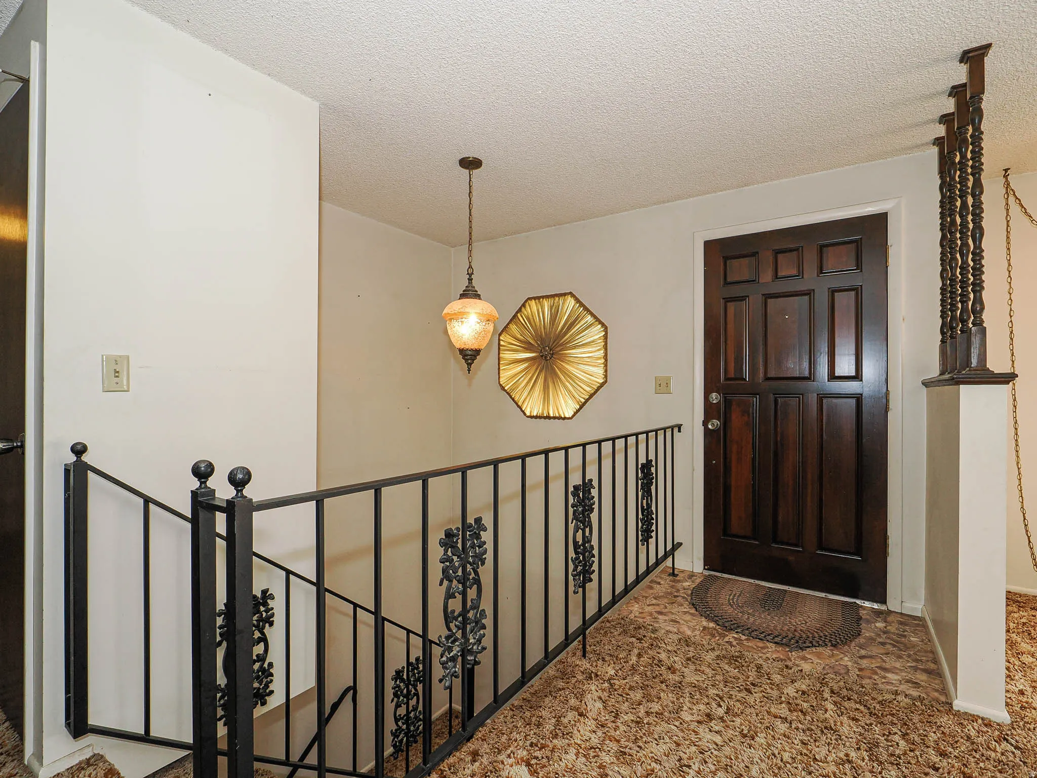 Paneled entry door with dark finish