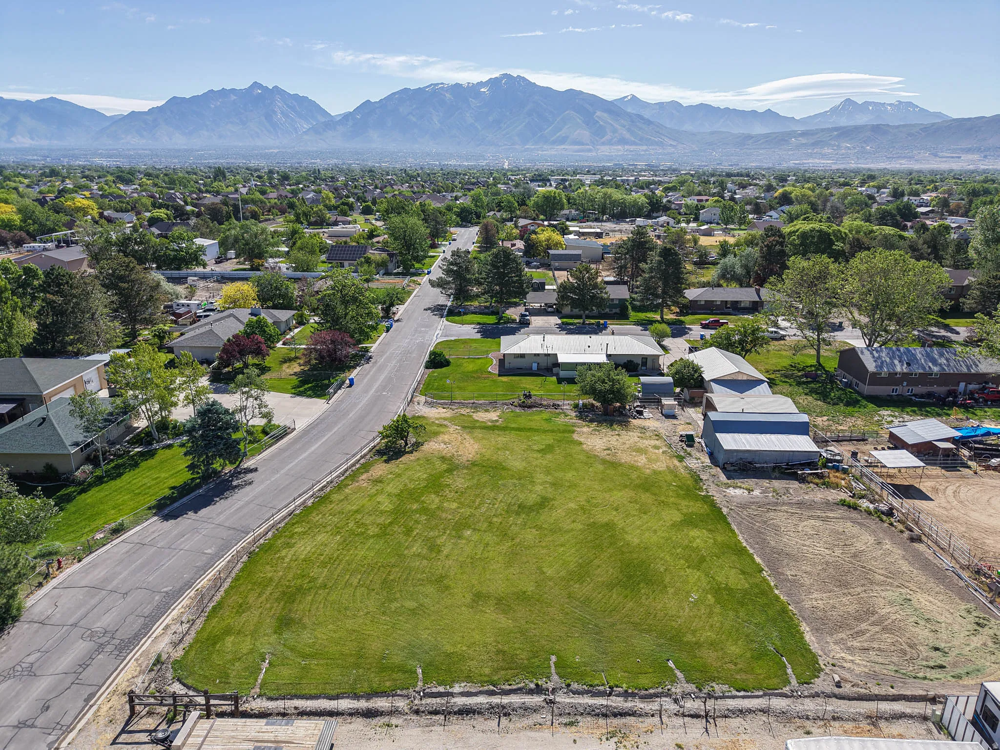 Expansive grass lot featuring a flat topography and direct road frontage