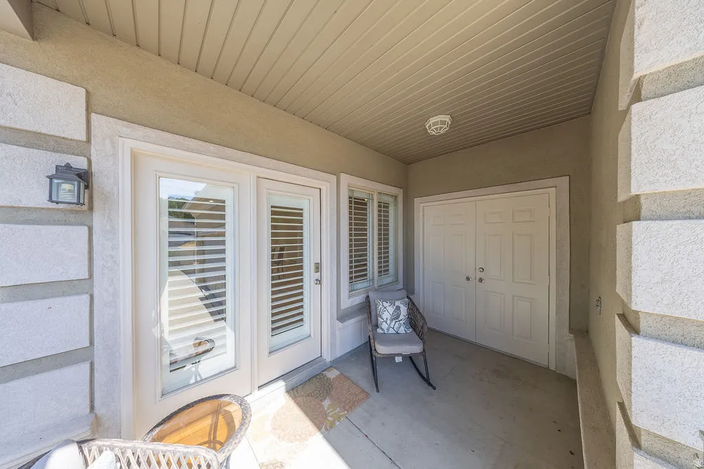 Covered patio with textured stucco walls and block accents