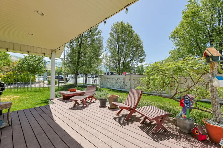 Spacious covered deck featuring composite wood-finish decking