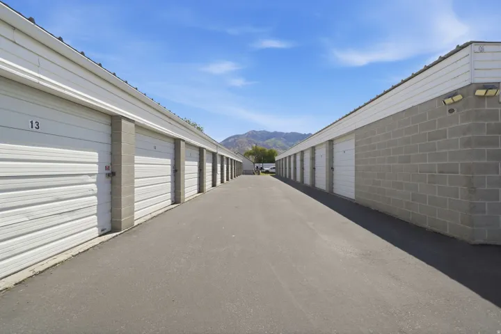 Paved drive aisle servicing multiple storage units