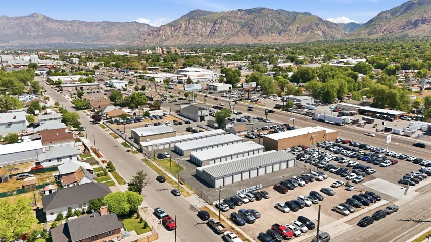 Aerial perspective showcasing an urban environment with commercial properties, residential structures, and established roadways