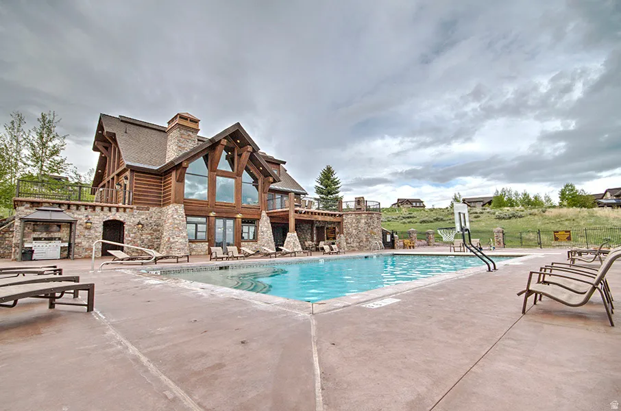 Outdoor swimming pool with concrete decking
