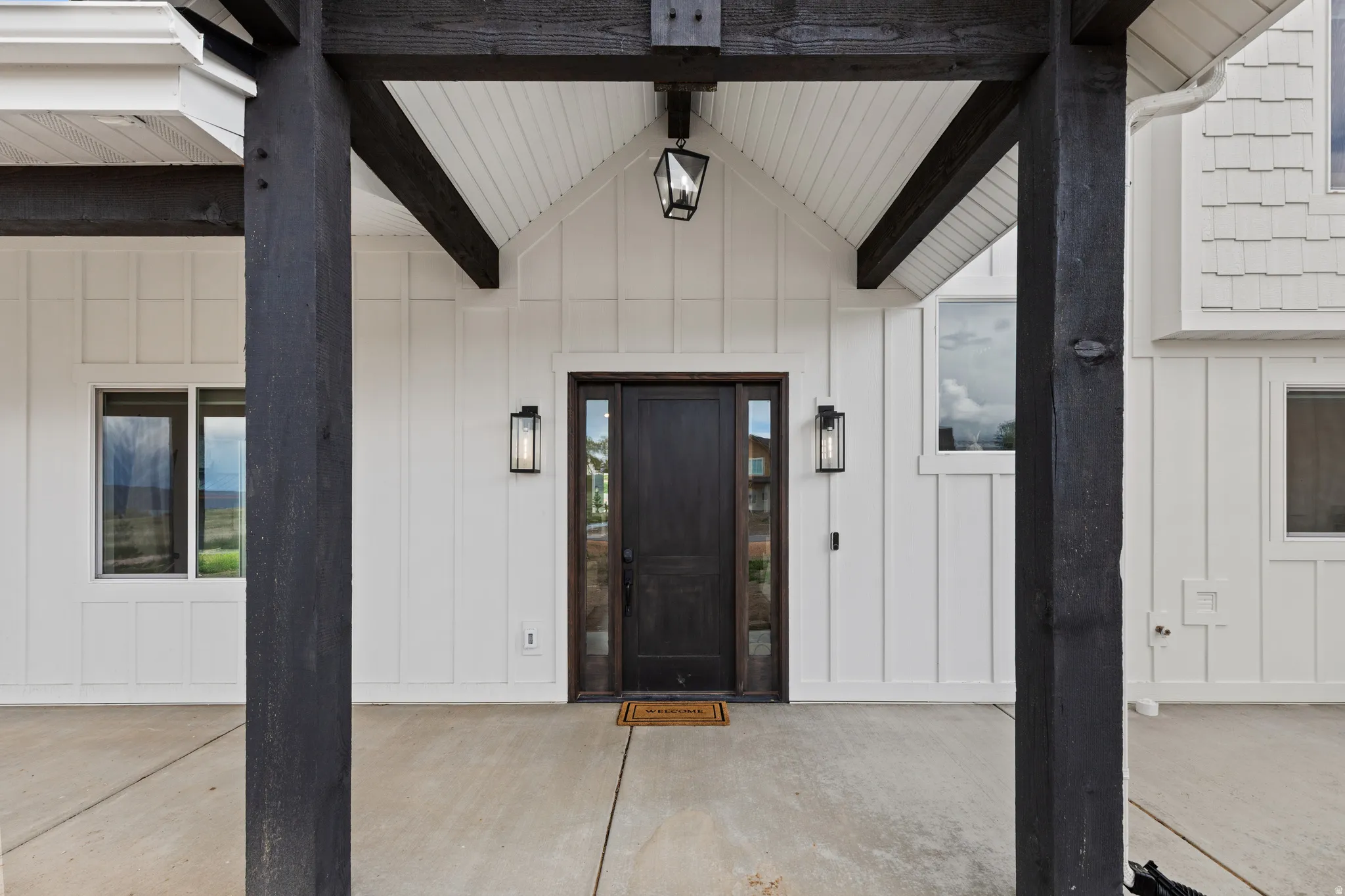 Modern farmhouse exterior featuring white board-and-batten siding