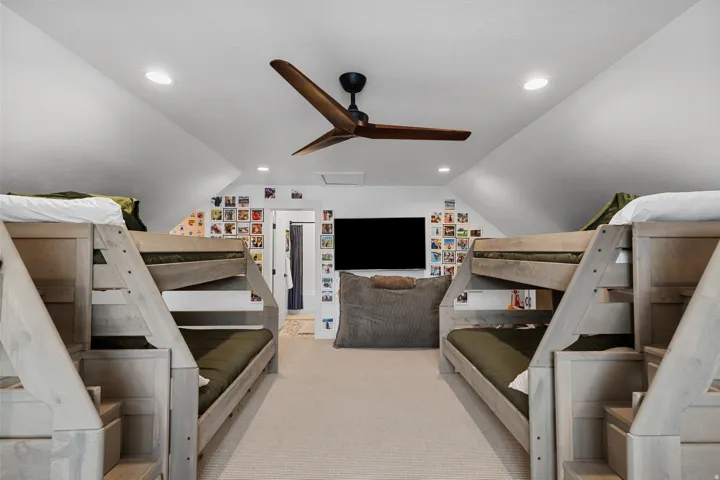 Open concept room featuring vaulted ceilings, recessed lighting, and a modern ceiling fan