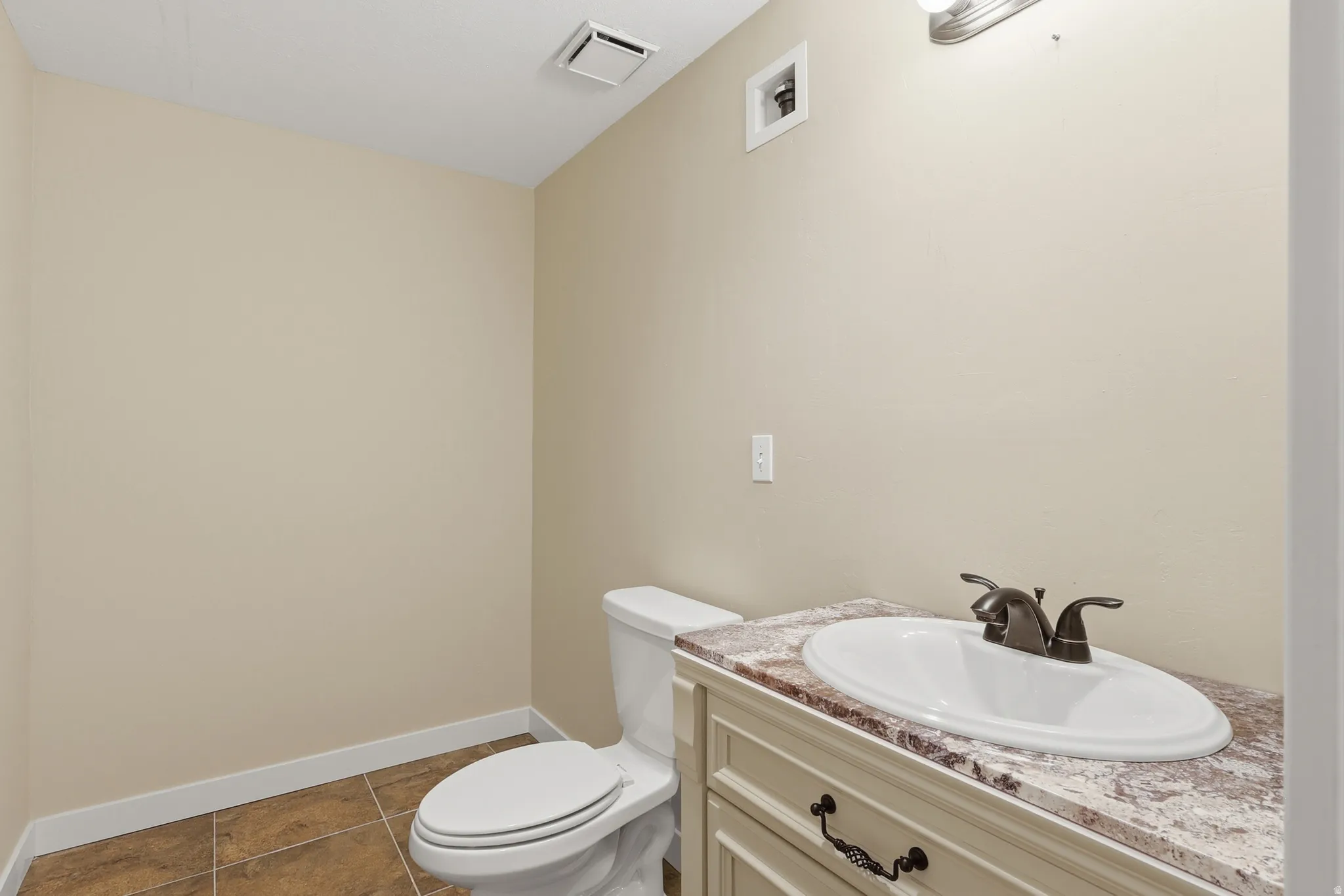 Bathroom #3 featuring a vanity with a white oval sink, dark bronze-finish faucet, and a space roughed in for a walk-in show or a tub/shower combo.