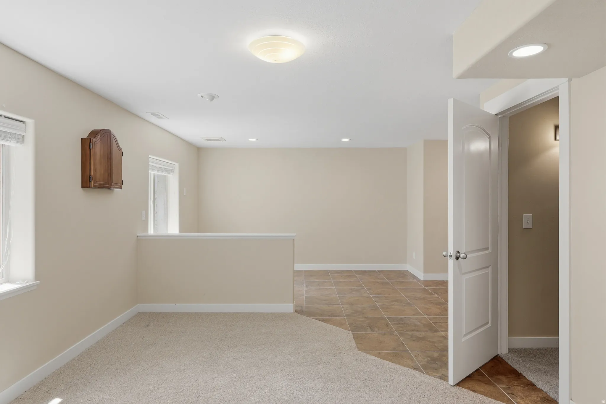 A large room used as a recreation room with a bar.  It could be two bedrooms if desired.