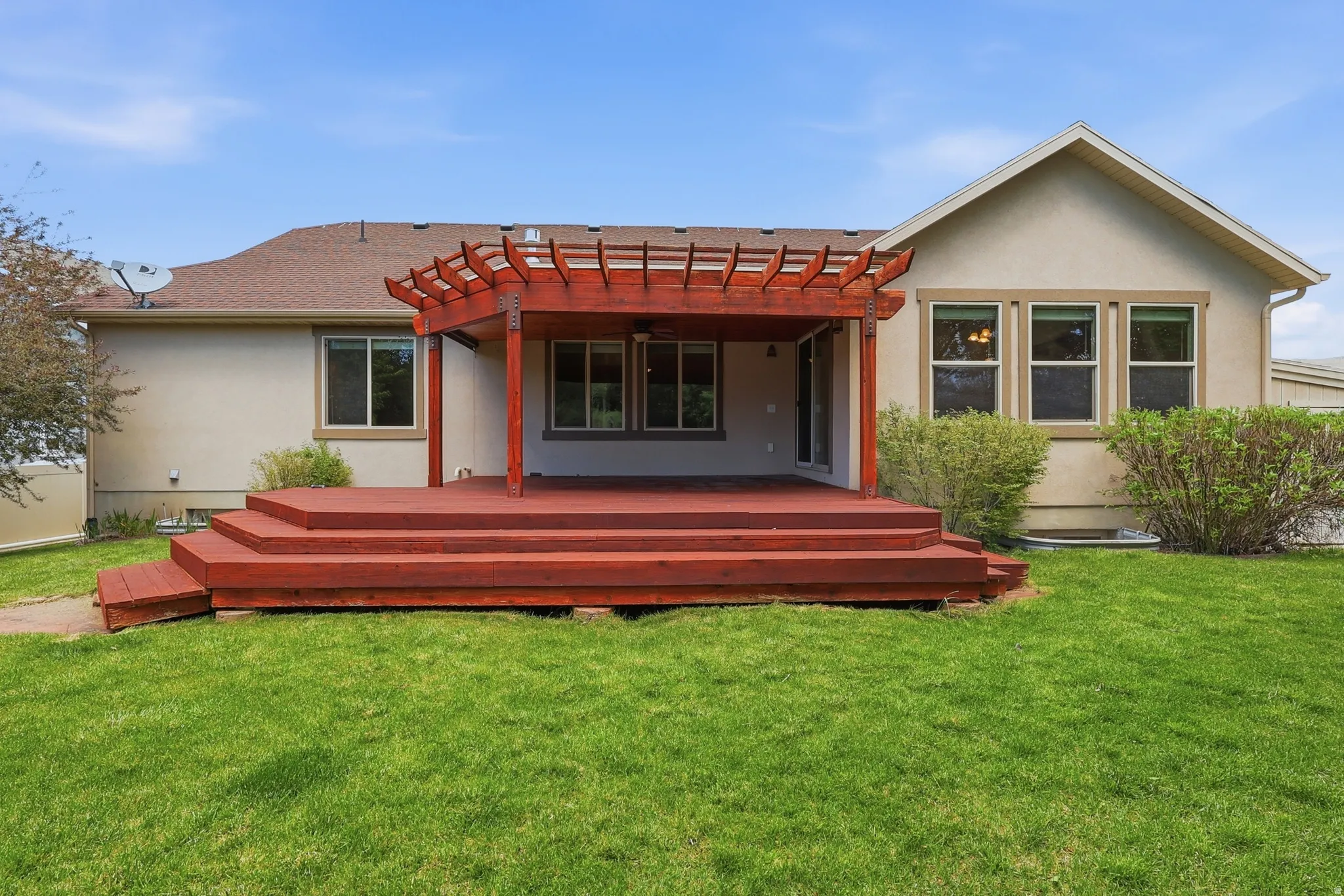 Beautifully landscaped private, fenced back yard with no back neighbors and a covered deck for BBQs, and relaxing.