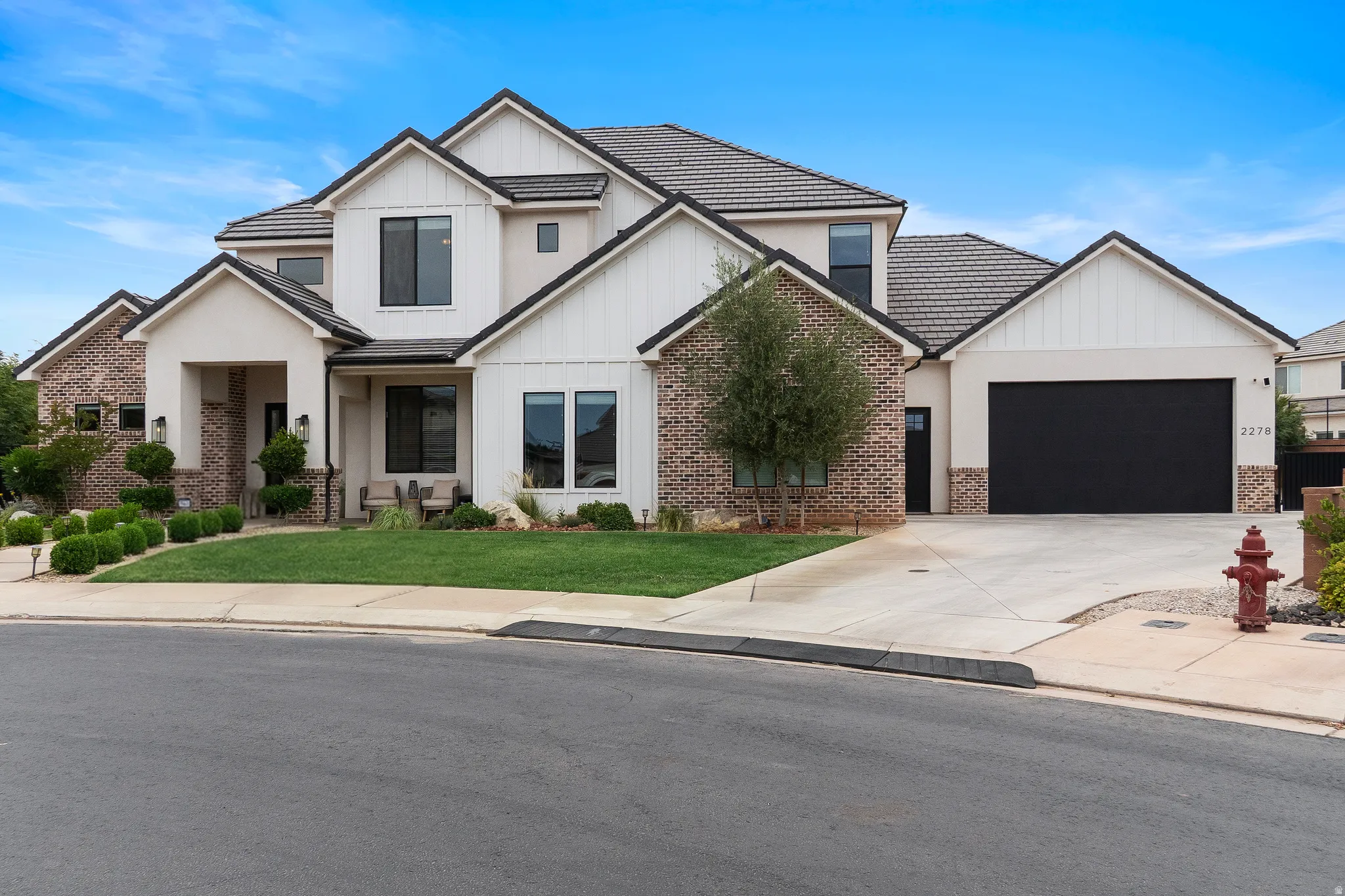 Contemporary architectural design featuring brick and stucco siding.