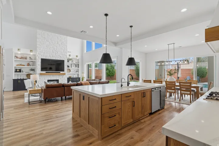 Open-concept interior featuring light wood-finish flooring throughout.