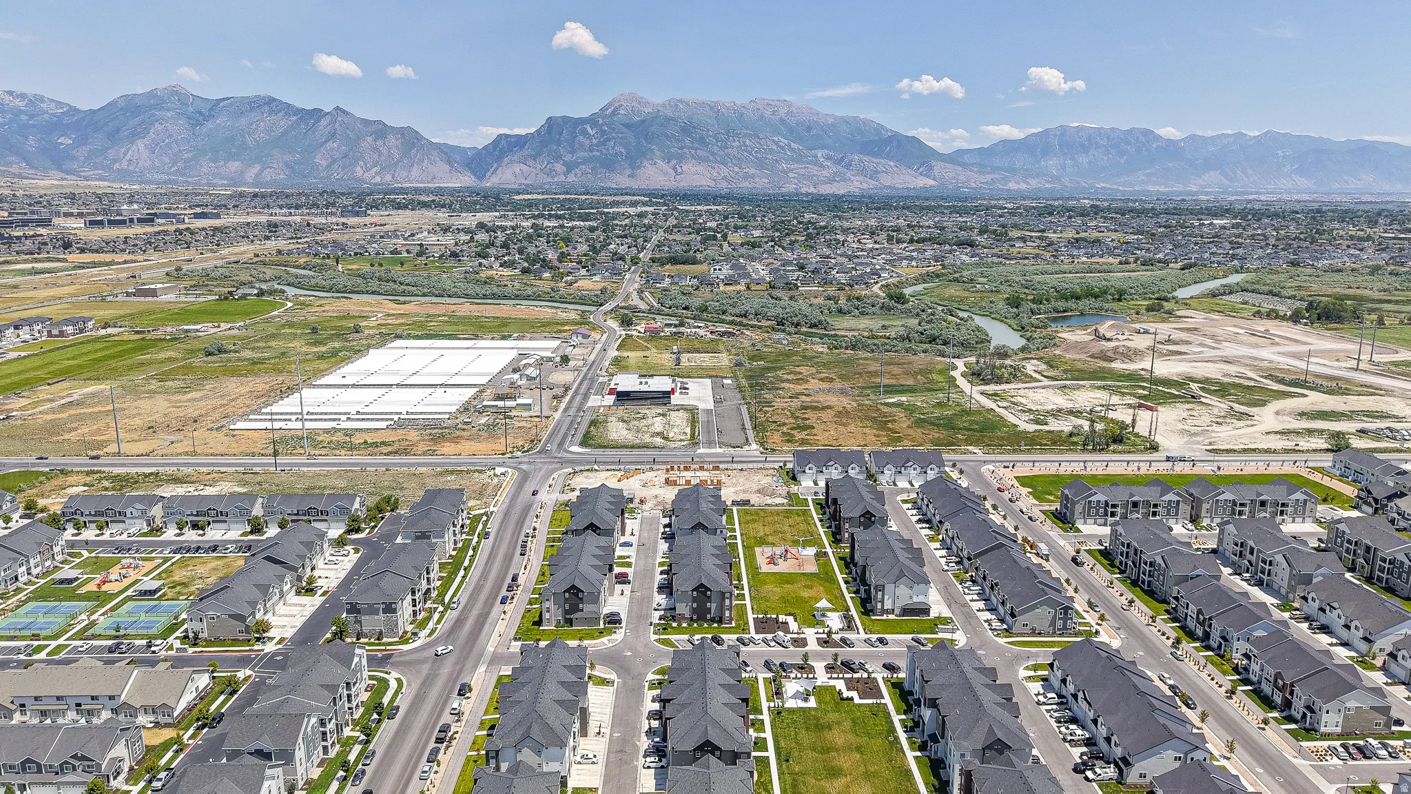 Aerial perspective showcasing a residential community with contemporary townhome-style residences