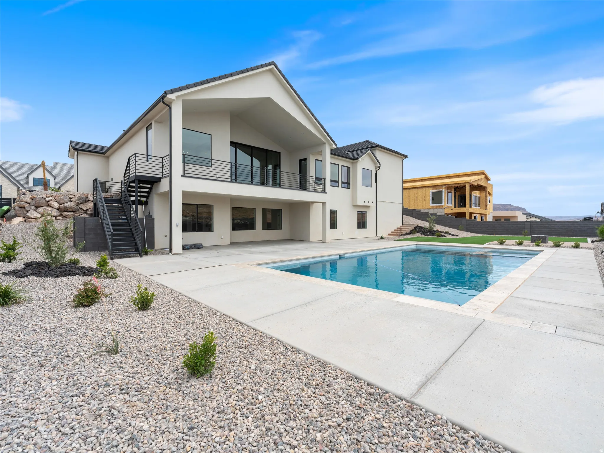 Contemporary exterior with a private swimming pool and expansive patio