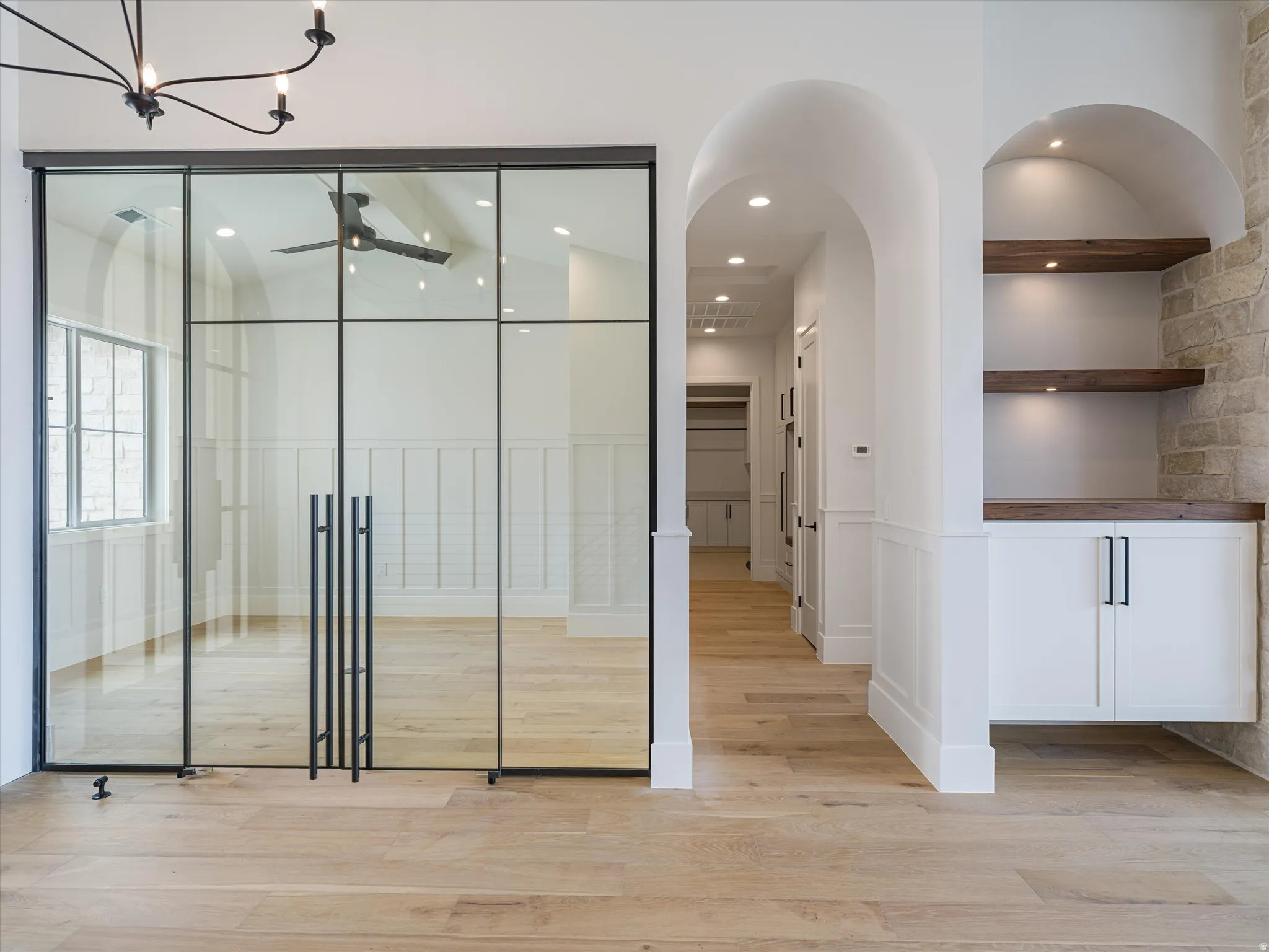 Glass paneled sliding doors with matte black hardware