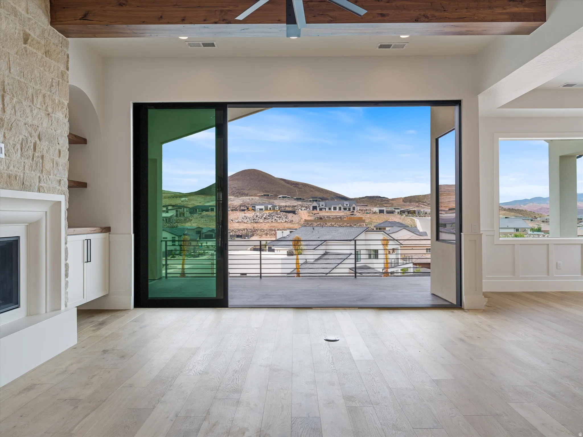 Expansive sliding glass doors opening to an outdoor balcony