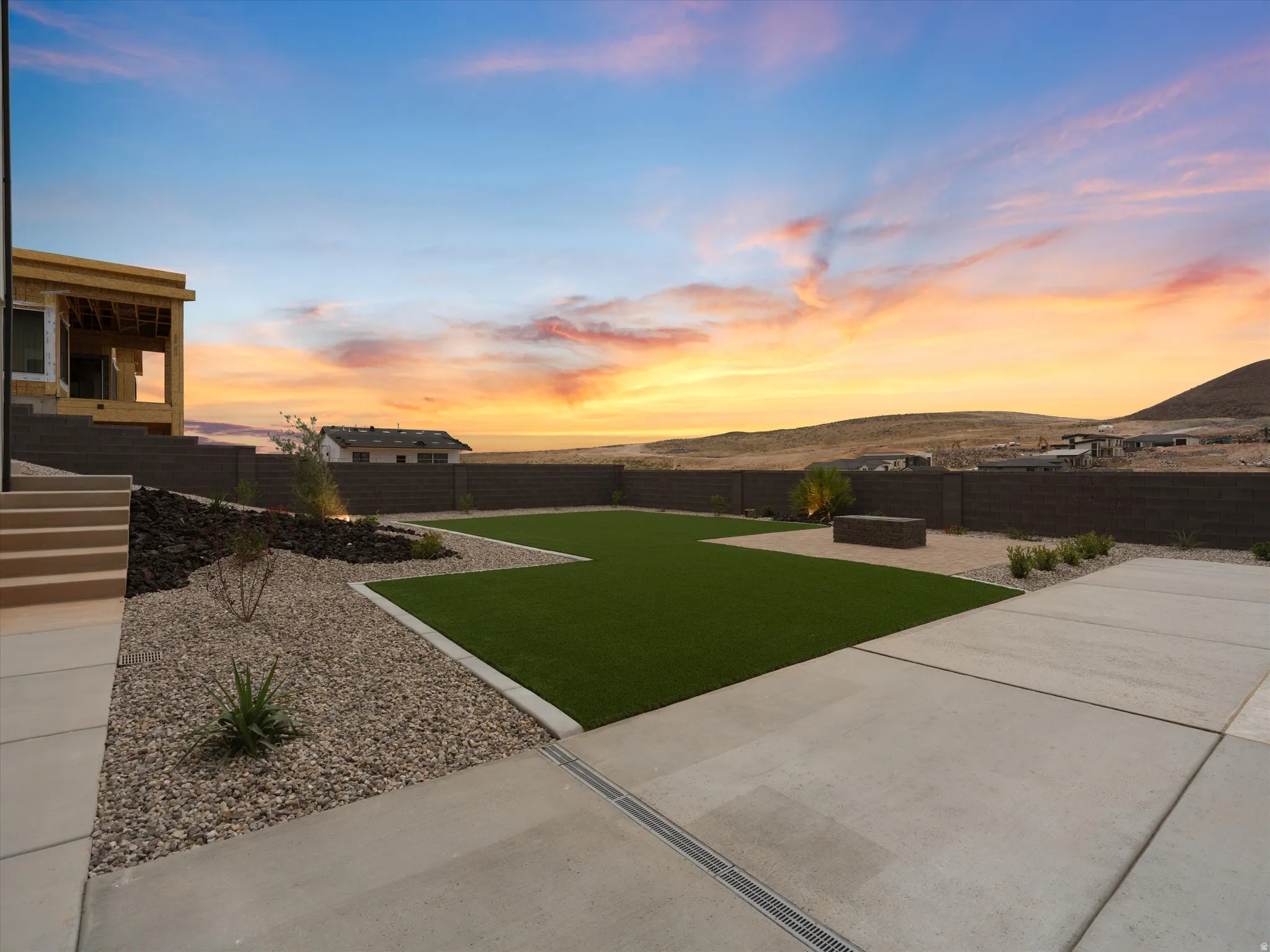 Expansive rear yard featuring a large artificial turf area