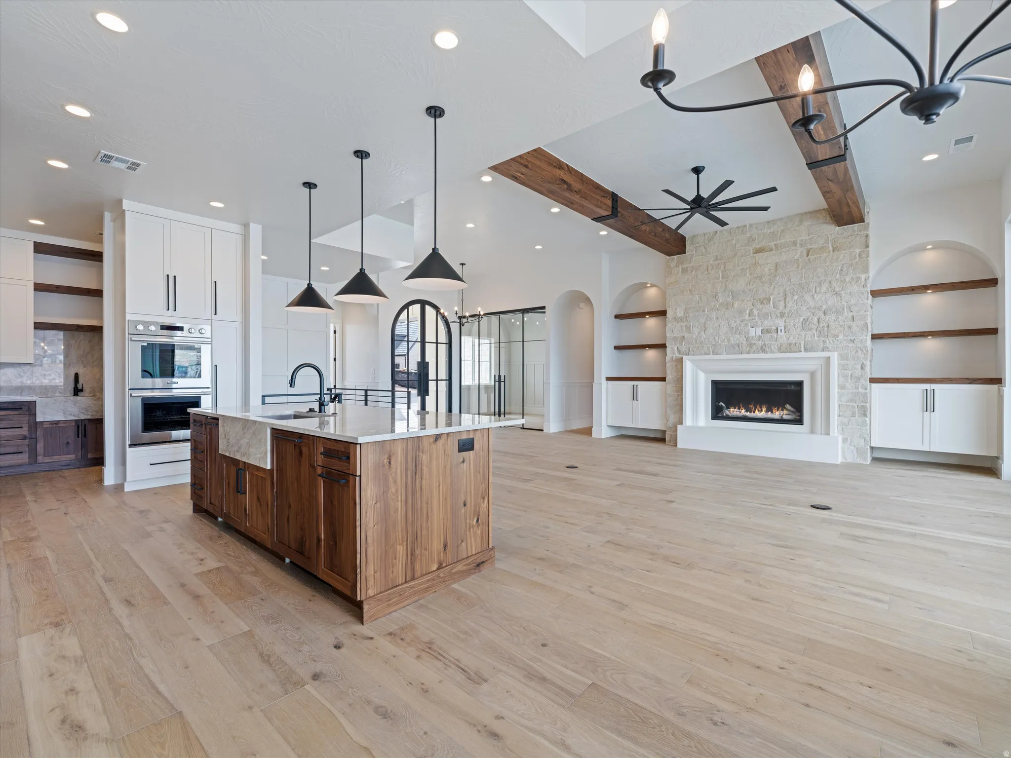 Open-concept interior featuring light wood-finish flooring throughout
