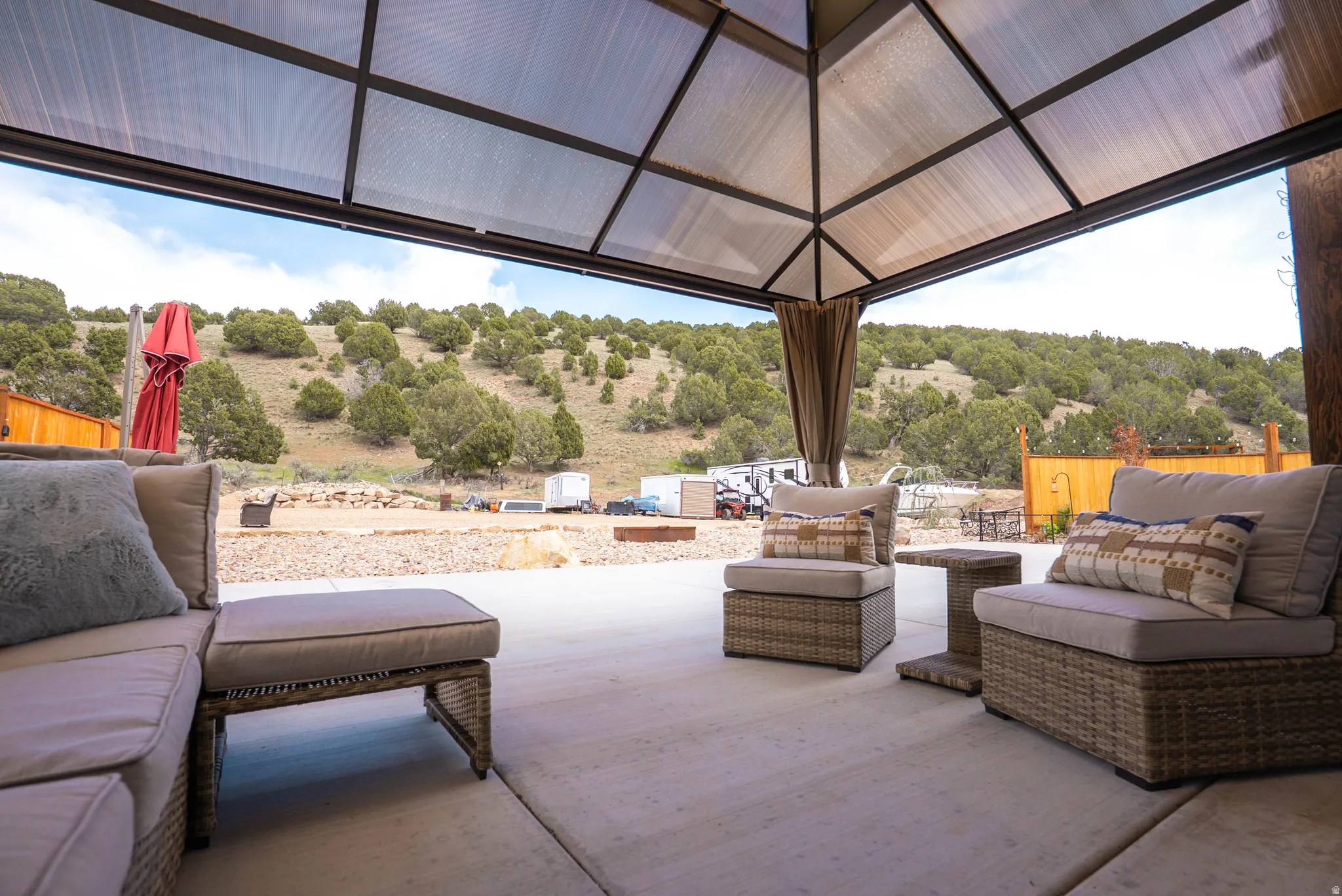 Expansive outdoor patio with a translucent roof and durable concrete flooring