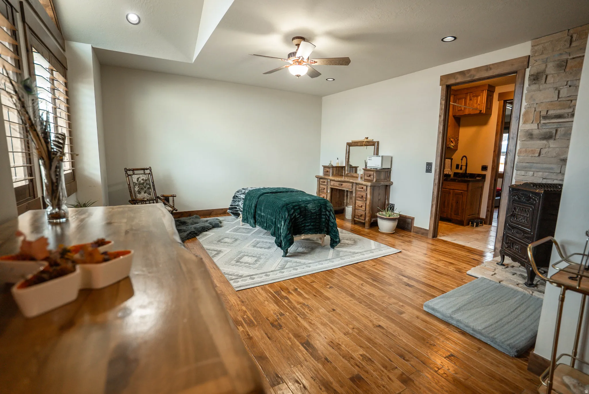 Room featuring wood-finish flooring, recessed lighting, and a ceiling fan